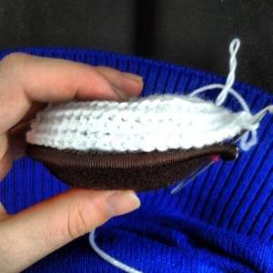 crochet curving around earmuff piece